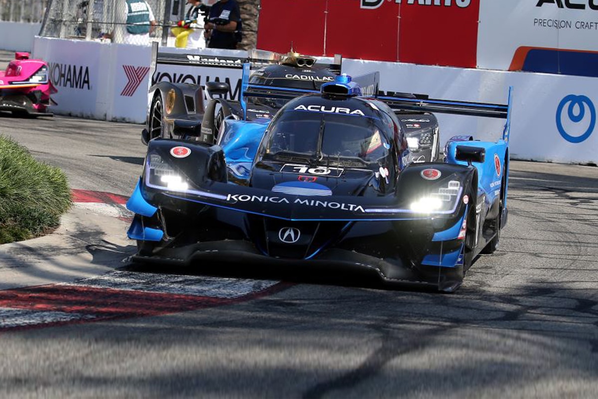 A racing car dressed in black and blue.
